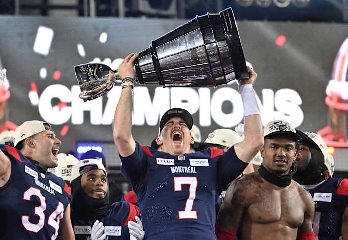 Nov 19, 2023; Hamilton, Ontario, CAN; Montreal Alouettes quarterback Cody Fajardo (7) lifts the Grey Cup trophy after the Alouettes defeated the Winnipeg Blue Bomber at Tim Hortons Field. Mandatory Credit: Dan Hamilton-USA TODAY Sports